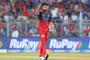 Suyash Sharma celebrates a wicket