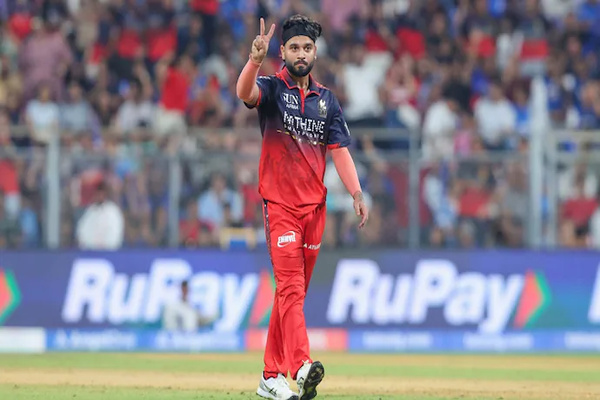 Suyash Sharma celebrates a wicket