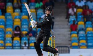 Mitchell Santner plays a shot